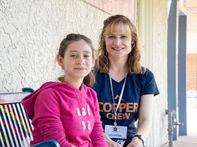 mother and daughter smiling for the camera